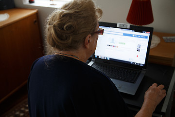 Image showing retired person with computer