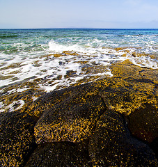 Image showing beach  light  water  foam rock spain   sky cloud beach  