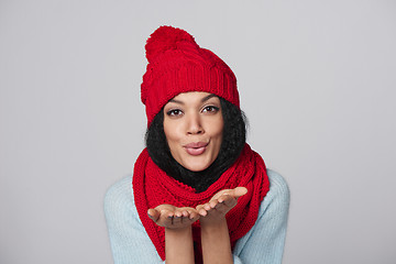 Image showing Winter girl blowing a kiss