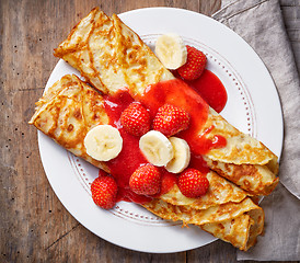 Image showing Crepes with strawberries and banana