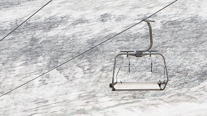 Image showing Empty ski lift above snow