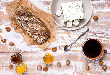 Image showing Morning tea Bread with seeds huzelnuts and cheese on board