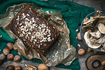 Image showing Closeup of bread with seeds, nuts and mushrooms
