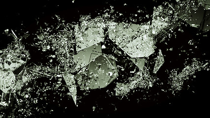 Image showing splitted or cracked glass on black