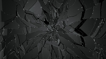 Image showing Pieces of splitted or broken glass on black