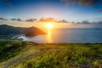 Image showing Village with beautiful sunset over hong kong coastline