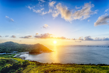 Image showing Village with beautiful sunset over hong kong coastline