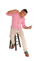 Image showing Man screaming at his tablet computer.