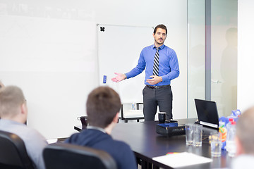 Image showing Business man making a presentation in office on job interview. 