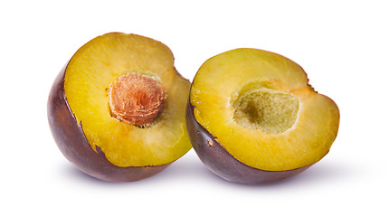 Image showing Two halves of violet plums near