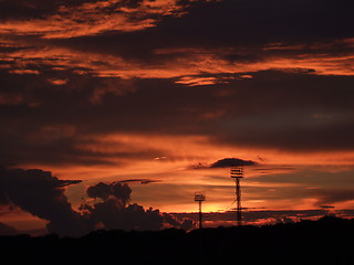 Image showing Spotlights in a sports arena in the sunset