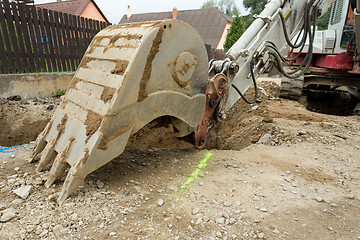 Image showing excavator ploughshare on trench - constructing canalization