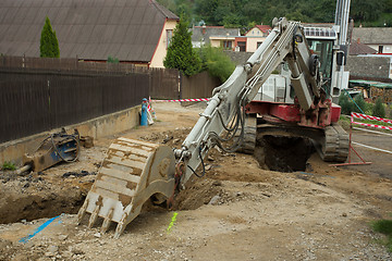 Image showing excavator ploughshare on trench - constructing canalization