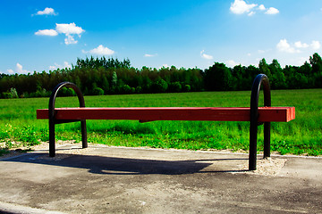 Image showing wooden bench. field