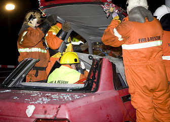Image showing firemen taking off the top