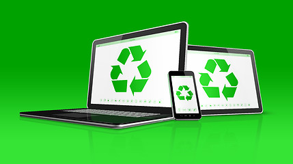 Image showing Laptop tablet PC and smartphone with a recycle symbol on screen.