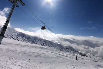 Image showing Gondola lift and ski slope at nice sunny day