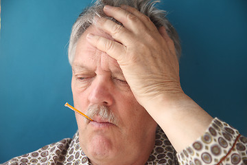 Image showing Older man has flu symptoms.