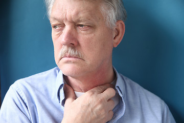 Image showing businessman with hand at throat 