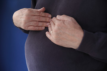 Image showing heavy man with heartburn	