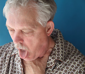 Image showing ill senior man coughing