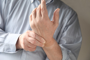 Image showing Man has pain in wrist.