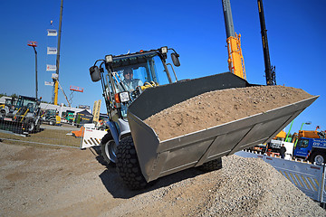 Image showing Man Works with Kramer Allrad 350 Wheel Loader