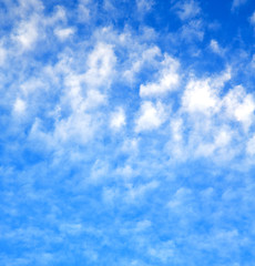 Image showing in the blue sky white soft clouds and abstract background