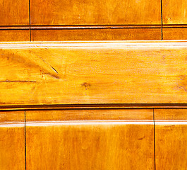 Image showing grain texture of a brown antique wooden old door in italy   euro