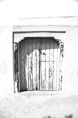 Image showing blue door in antique village santorini greece europe and    whit