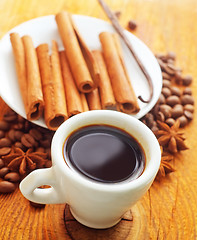 Image showing cinnamon and coffee on the white plate