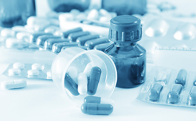 Image showing color pills and medical bottle