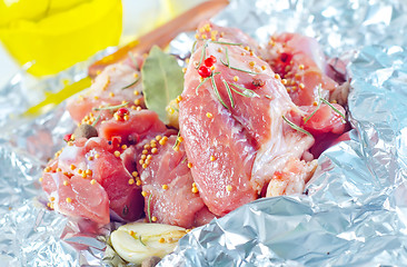 Image showing raw meat in the foil