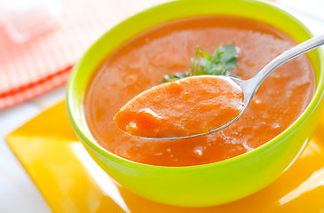 Image showing Fresh soup from pumpkin in the green bowl