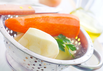 Image showing Raw potato and carrot in the metal bowl