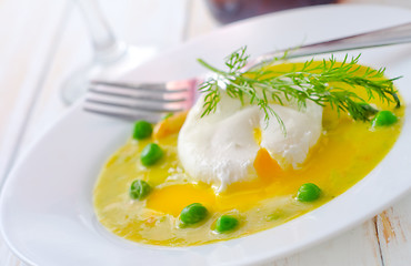 Image showing Fresh soup from green peas and egg-poached