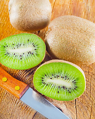 Image showing fresh kiwi on the wooden board