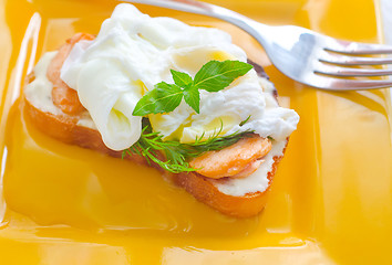 Image showing Close Up of Poached Delicious Egg with Whole Grain Bread