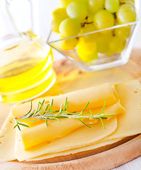 Image showing italian cheese with fresh rosemary and grape
