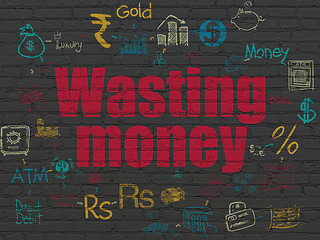 Image showing Money concept: Wasting Money on wall background