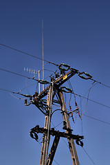 Image showing Electric post and blue sky