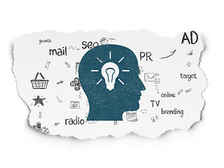 Image showing Marketing concept: Head With Light Bulb on Torn Paper background