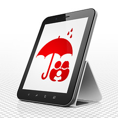 Image showing Insurance concept: Tablet Computer with Family And Umbrella on display