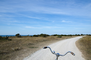 Image showing Biking on a gravel road