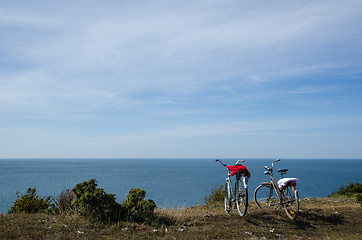 Image showing Two bikes by the coast