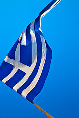 Image showing waving greece flag in the blue sky and flagpole