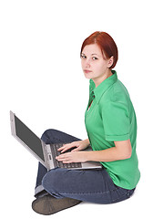 Image showing Redheaded girl with a laptop