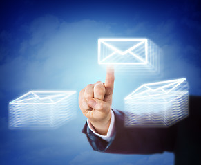 Image showing Hand Moving Email Between Two Document Stacks