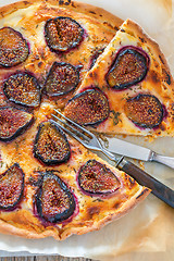 Image showing Pizza with figs and thyme. Top view.