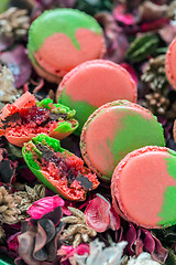 Image showing Macarons and flower petals.